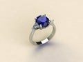 Sapphire with Triangular Diamond Side Stones